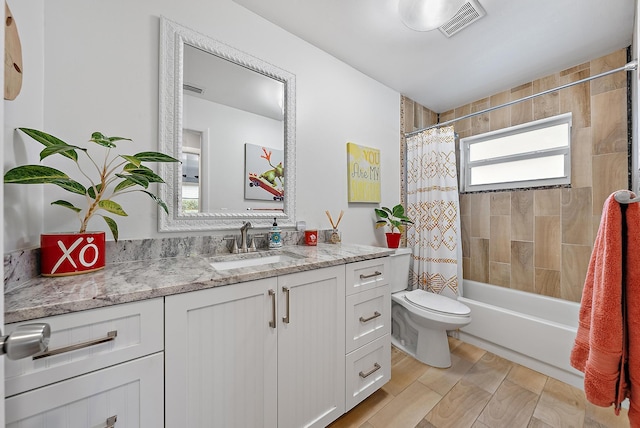 full bathroom featuring vanity, toilet, and shower / bath combo