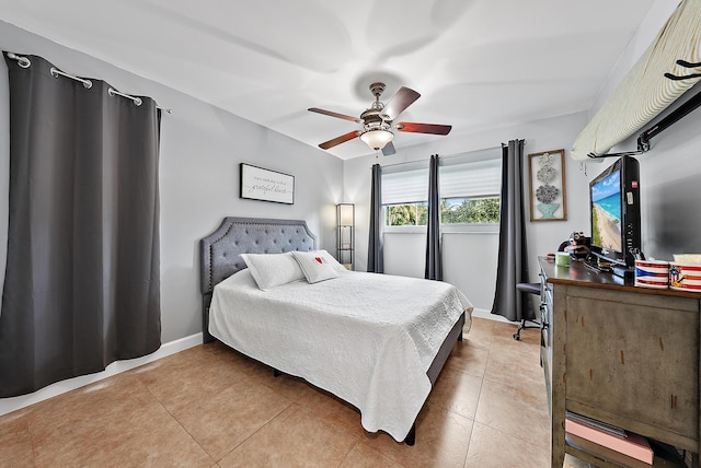 bedroom featuring tile patterned flooring and ceiling fan