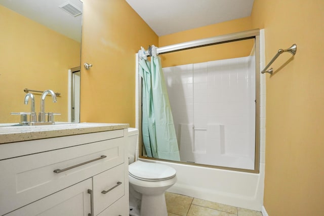 full bathroom with tile patterned flooring, vanity, toilet, and shower / bath combo with shower curtain