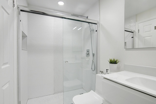 42 Burgundy Unit A, Delray Beach, FL 33484 - bathroom with vanity, toilet, and a shower with shower door