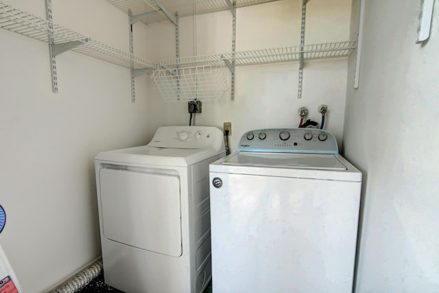 42 Burgundy Unit A, Delray Beach, FL 33484 - clothes washing area featuring washing machine and clothes dryer