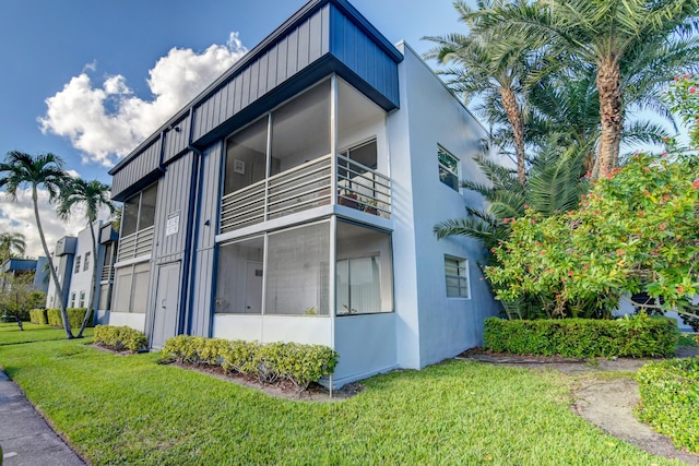 42 Burgundy Unit A, Delray Beach, FL 33484 - view of home's exterior with a yard