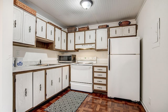 42 Burgundy Unit A, Delray Beach, FL 33484 - kitchen with white cabinetry, white appliances, dark parquet flooring, and sink