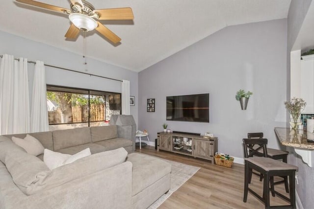 1060 NW 19th Ter, Delray Beach, FL 33445 - living room featuring lofted ceiling, wood finished floors, and a ceiling fan