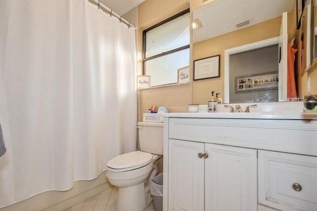 full bathroom featuring vanity, shower / bathtub combination with curtain, tile patterned floors, and toilet