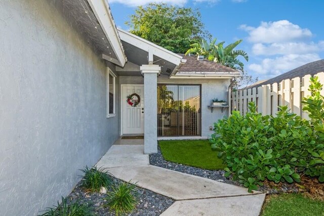 1060 NW 19th Ter, Delray Beach, FL 33445 - doorway to property featuring stucco siding