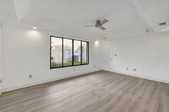 empty room featuring ceiling fan and light wood-type flooring