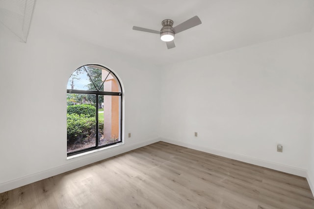 unfurnished room featuring ceiling fan and light wood-type flooring