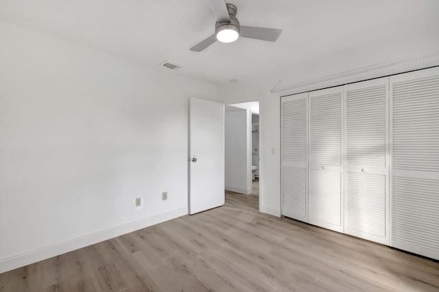 unfurnished bedroom featuring a closet, ceiling fan, and light hardwood / wood-style flooring