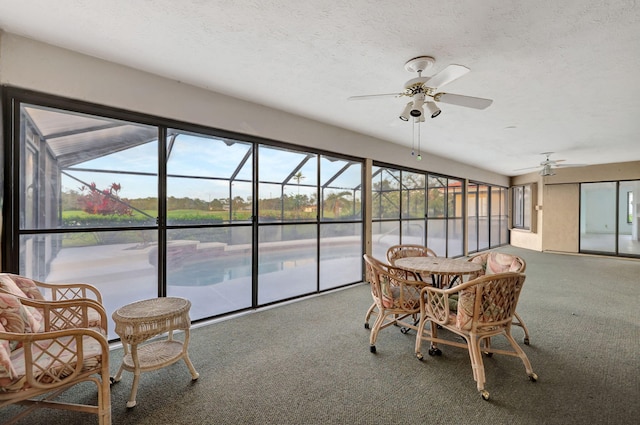 sunroom / solarium with ceiling fan