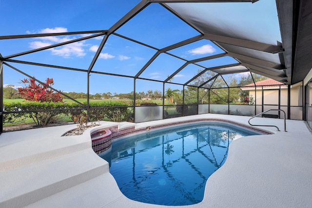 view of pool featuring a patio and glass enclosure