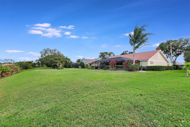 view of yard with a lanai