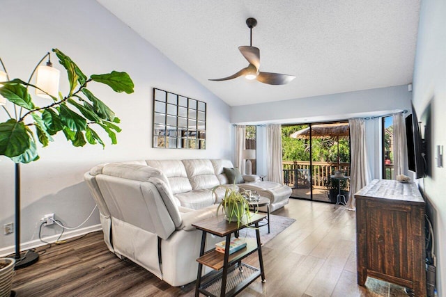 living room featuring lofted ceiling, hardwood / wood-style floors, a textured ceiling, and ceiling fan