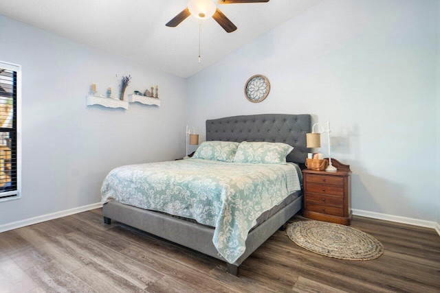 bedroom featuring dark wood-type flooring, ceiling fan, and vaulted ceiling