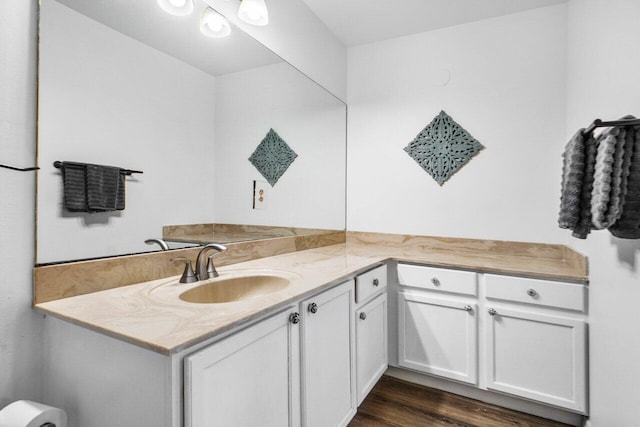 bathroom featuring hardwood / wood-style flooring and vanity