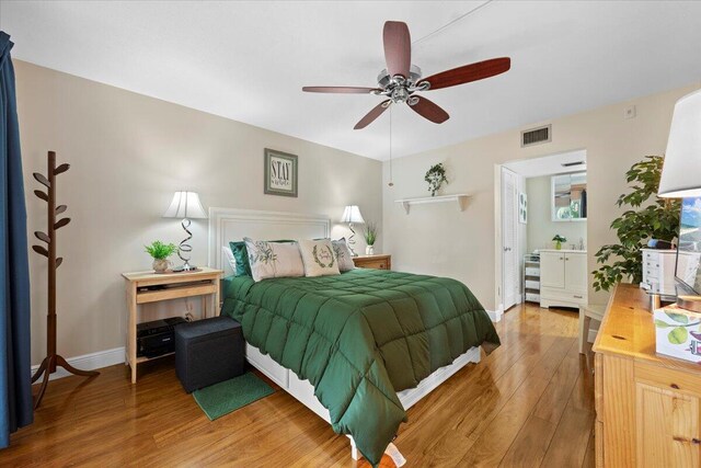 bedroom featuring dark hardwood / wood-style flooring, access to outside, and ceiling fan