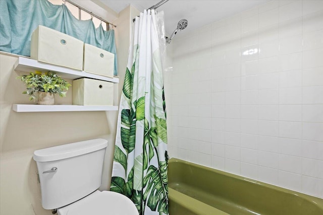 bathroom featuring toilet and shower / bath combo with shower curtain