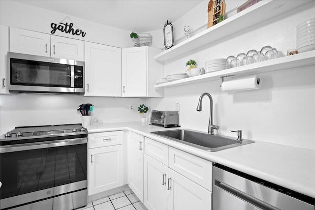 kitchen featuring sink, white cabinets, and stainless steel appliances