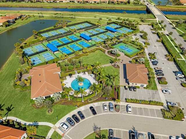 birds eye view of property with a water view