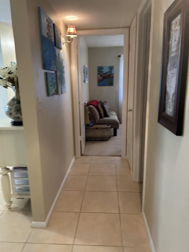 corridor featuring light tile patterned flooring