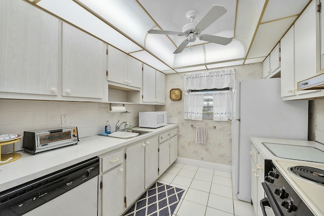 kitchen with light tile patterned flooring, electric range oven, dishwasher, sink, and white cabinets