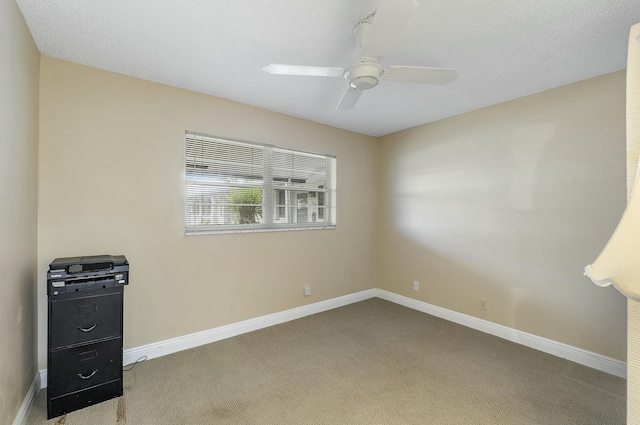 empty room with carpet floors and ceiling fan