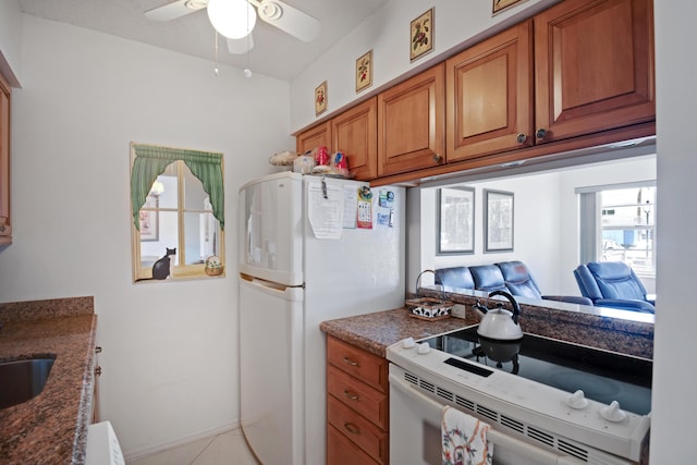 kitchen with ceiling fan and white appliances