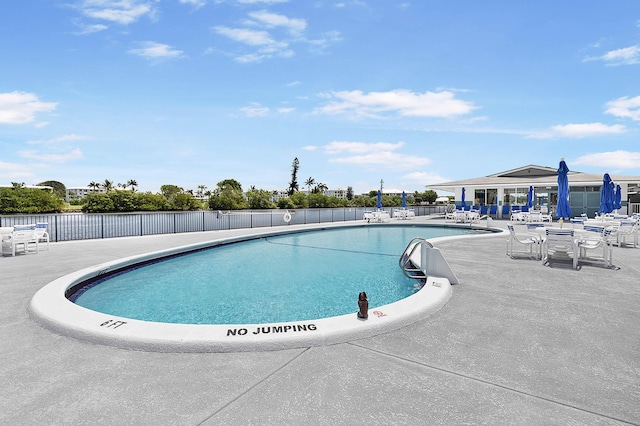 view of swimming pool with a patio area