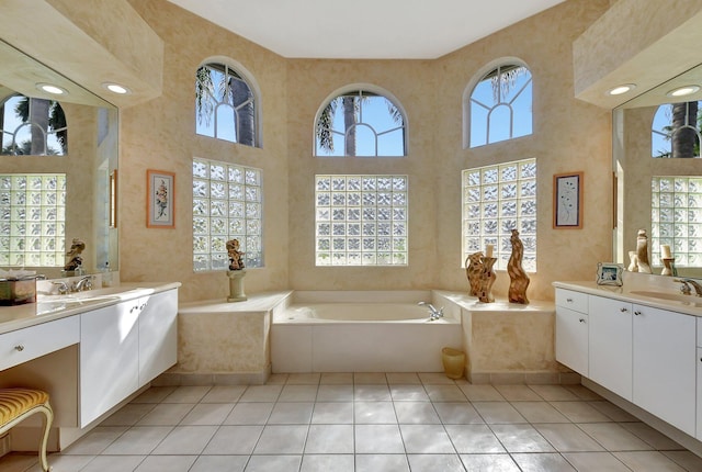 bathroom with a wealth of natural light and tile patterned floors