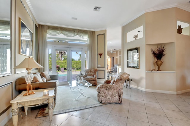 sitting room featuring light tile patterned floors, ornamental molding, and french doors