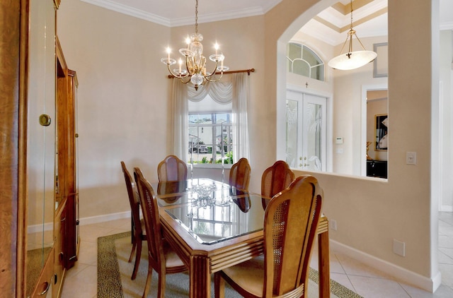 dining area featuring light tile patterned flooring, a towering ceiling, ornamental molding, and an inviting chandelier