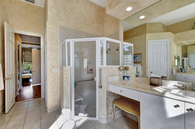 bathroom featuring an enclosed shower, vanity, and tile patterned floors