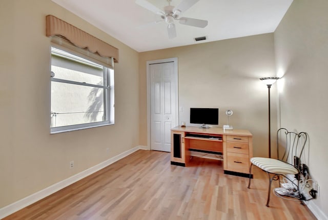 home office featuring ceiling fan and light hardwood / wood-style floors