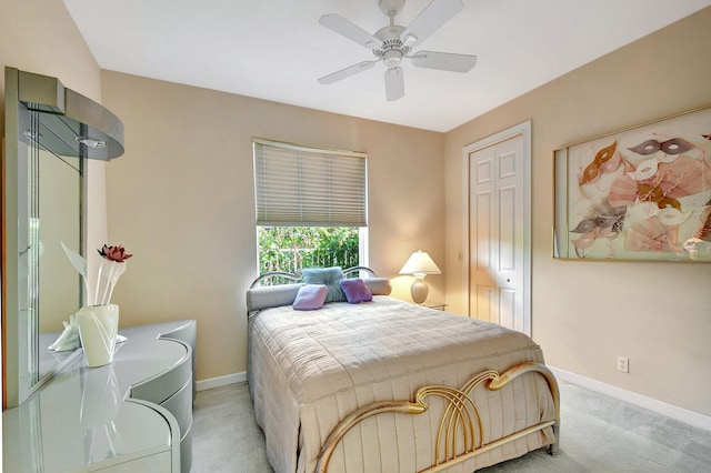 bedroom with light carpet and ceiling fan