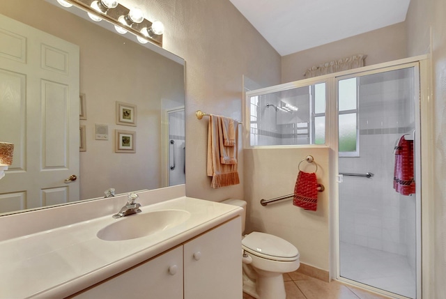 bathroom with tile patterned floors, toilet, an enclosed shower, and vanity