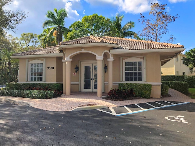 mediterranean / spanish home with french doors