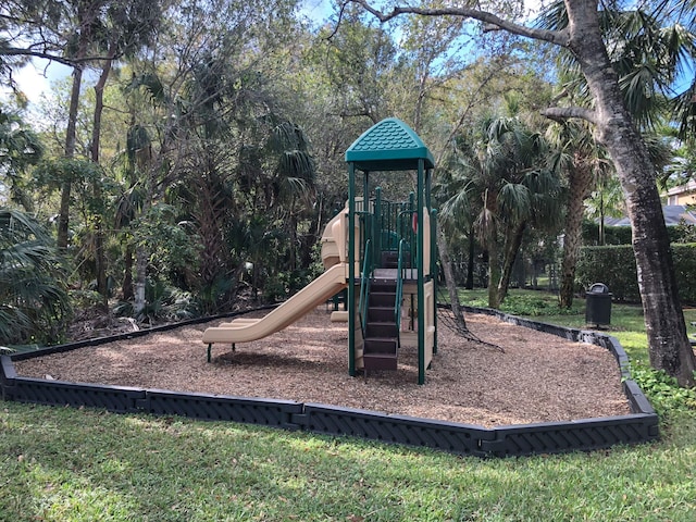 view of jungle gym featuring a lawn