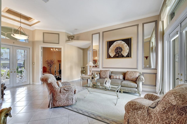 living room featuring crown molding, a tray ceiling, light tile patterned floors, and french doors