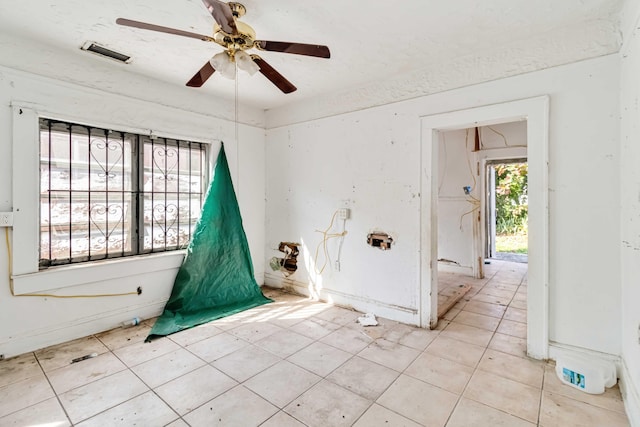 1839 NW 49th St, Miami, FL 33142 - spare room with a textured ceiling and ceiling fan