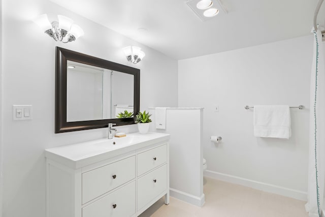 bathroom with vanity and toilet