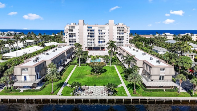 birds eye view of property with a water view