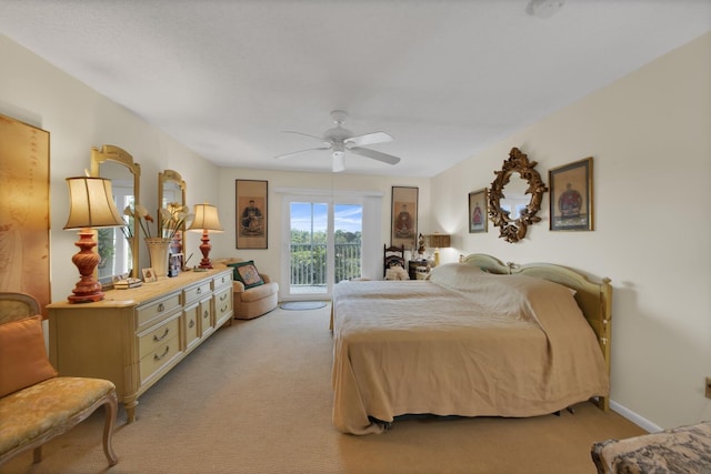 bedroom with light carpet, access to exterior, and ceiling fan