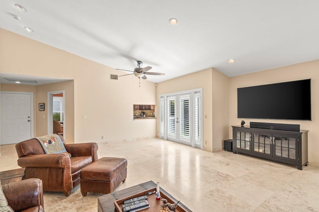 living room featuring french doors and ceiling fan