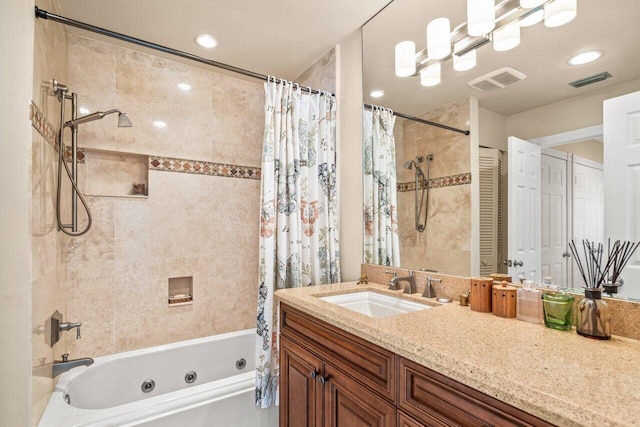 bathroom with shower / tub combo with curtain and vanity