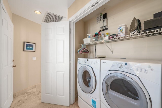 laundry area featuring washer and clothes dryer