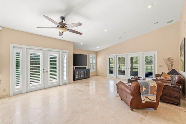 living room with vaulted ceiling, french doors, and ceiling fan