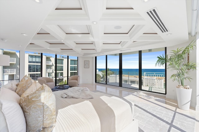 tiled bedroom with a water view, expansive windows, access to exterior, and beam ceiling