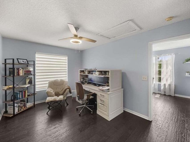 office space featuring dark wood-type flooring, a textured ceiling, and ceiling fan