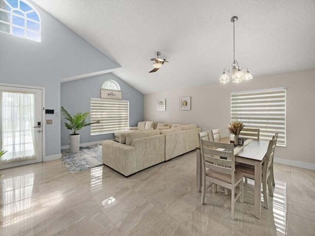 dining room with vaulted ceiling, a textured ceiling, and a notable chandelier