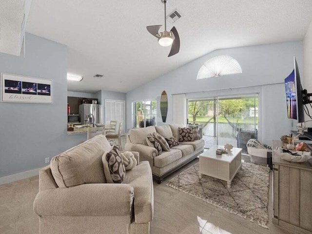 living room featuring lofted ceiling and ceiling fan